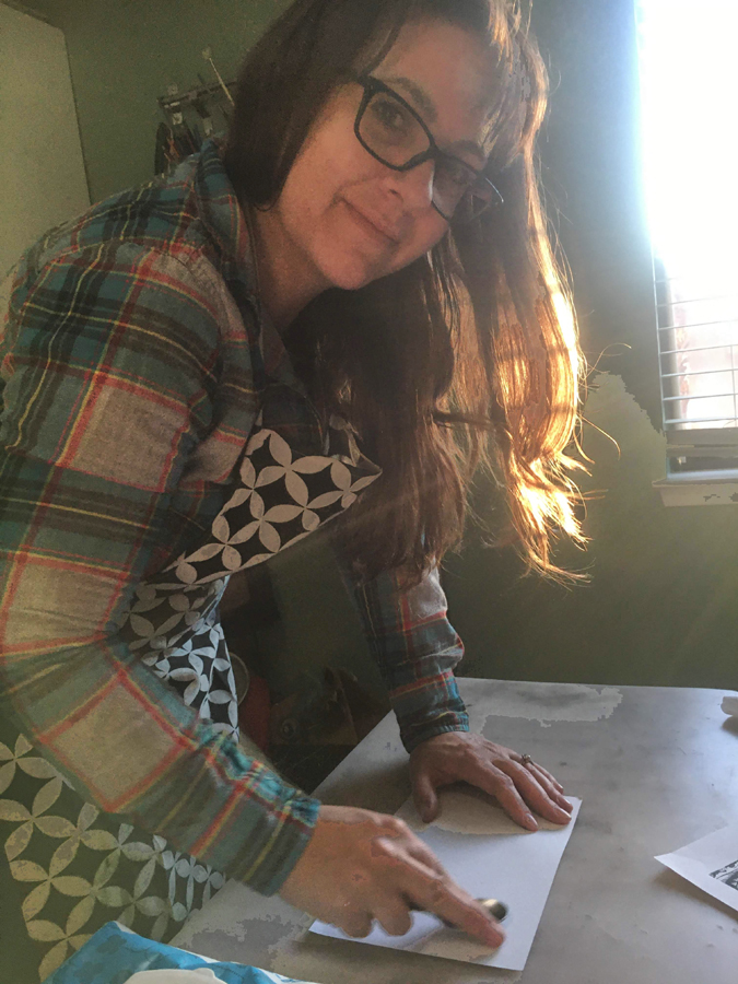 About Artist Mary Vasquez hand pressing her Linocut prints. 
