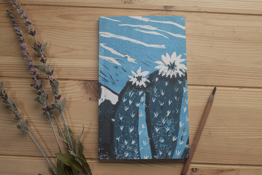 This is a photo of a turquoise cactus flower notebook